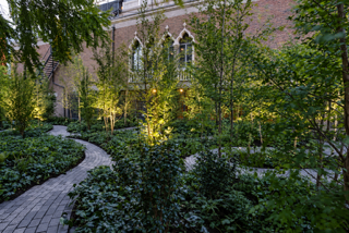 Landscaped garden courtyard with a curved stone path